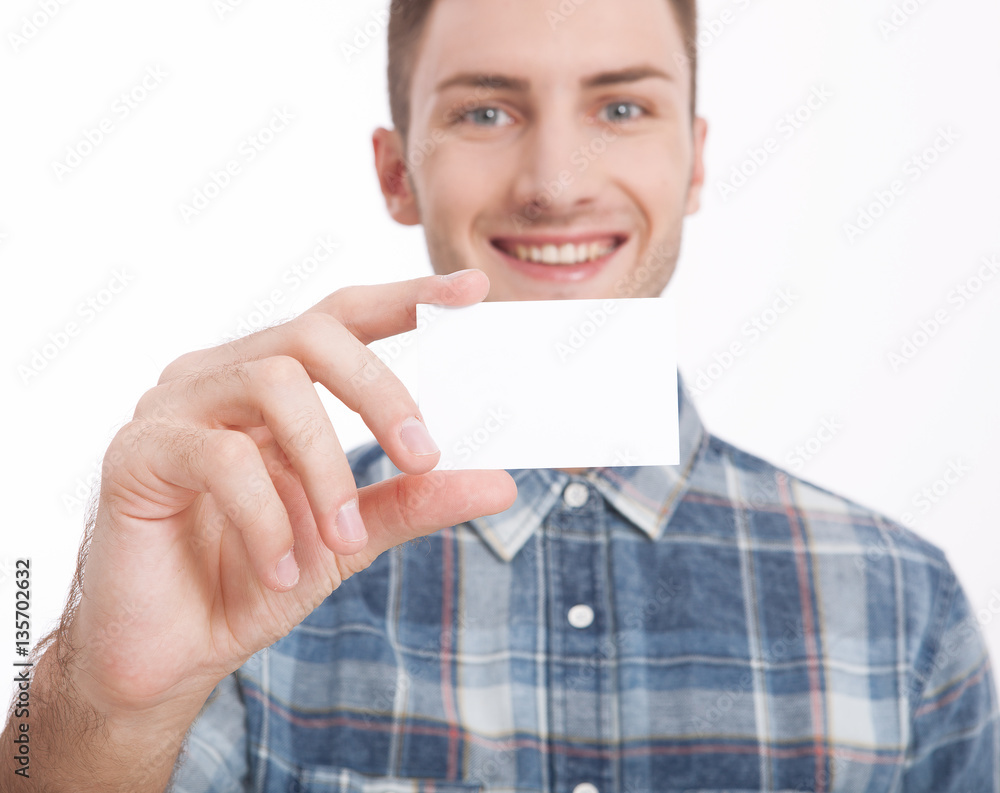 Handsome man holding and showing a blank sheet of paper. White blank billboard close-up on white background. Mock up. Handsome man holding and showing a blank sheet of paper. White blank billboard close-up on white background. Mock up.