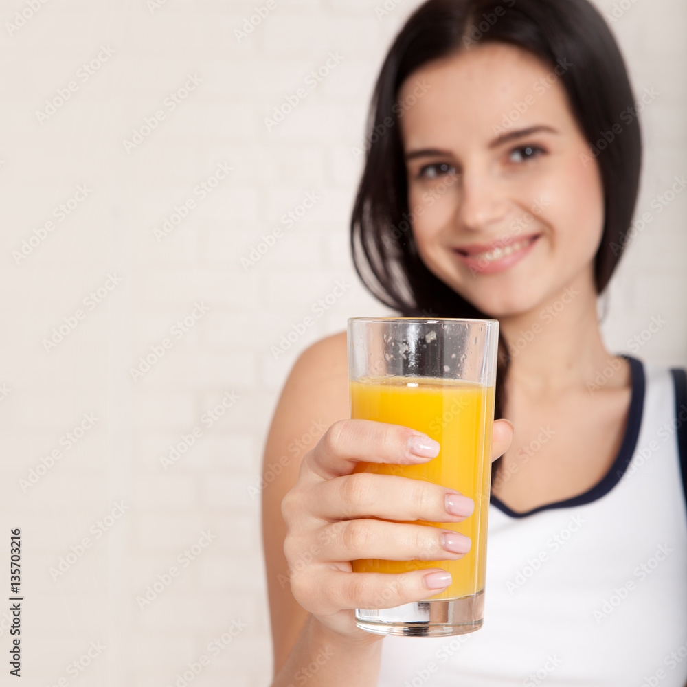 Closeup photo of sexy young woman drinking orange juice Closeup photo of sexy young woman drinking orange juice