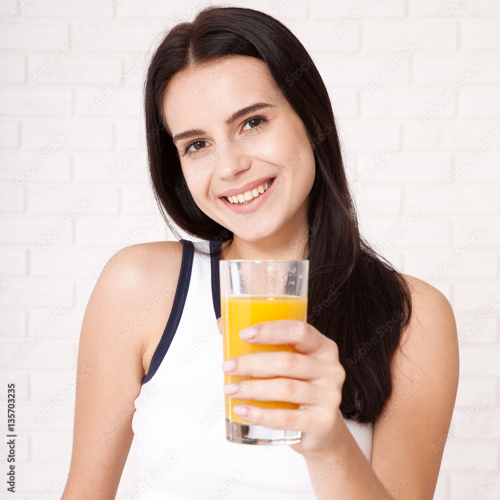 Closeup photo of sexy young woman drinking orange juice Closeup photo of sexy young woman drinking orange juice