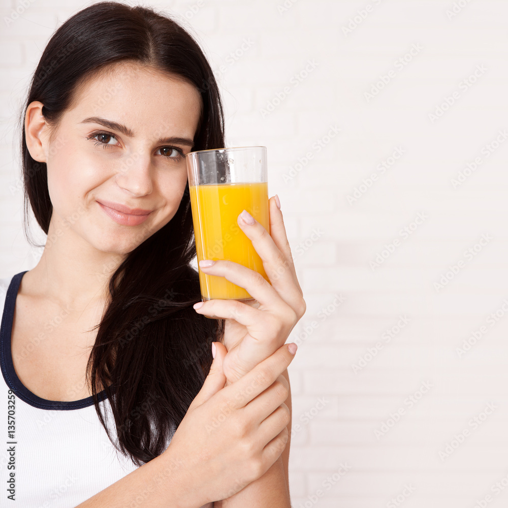 Closeup photo of sexy young woman drinking orange juice Closeup photo of sexy young woman drinking orange juice