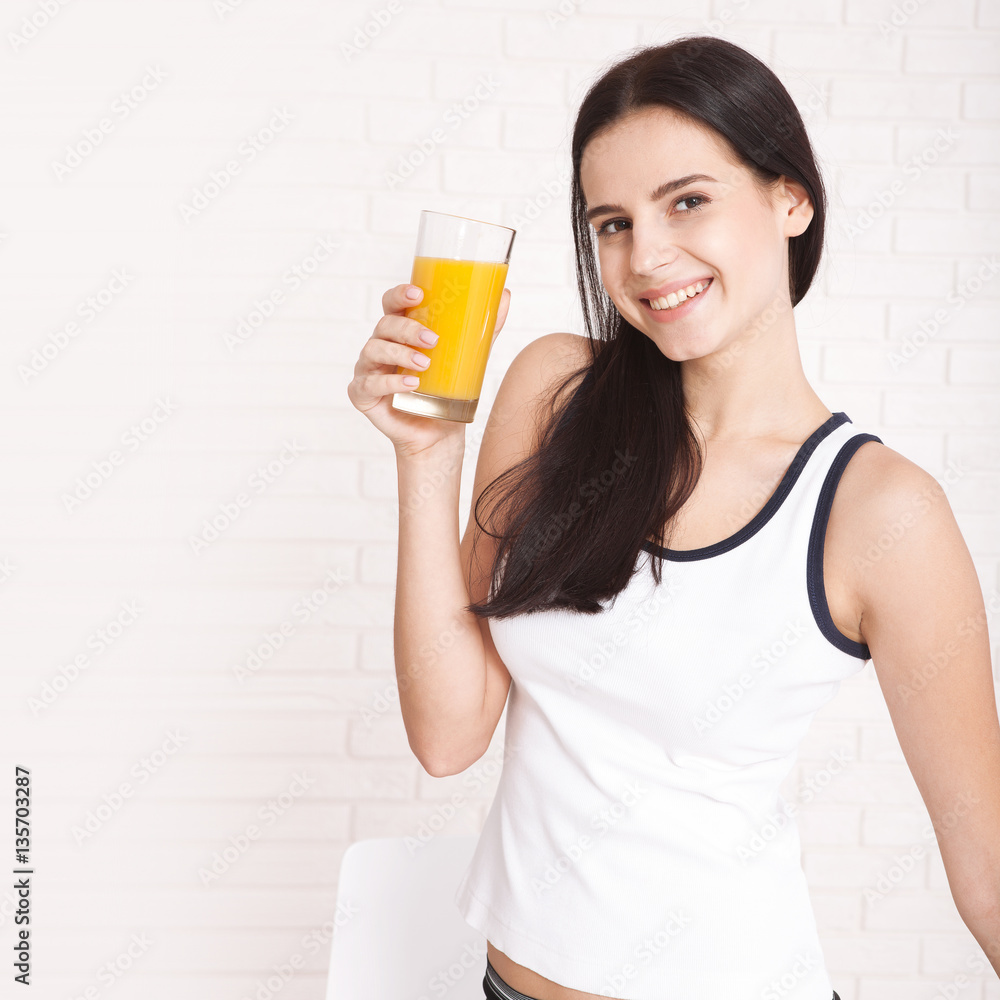 Closeup photo of sexy young woman drinking orange juice Closeup photo of sexy young woman drinking orange juice