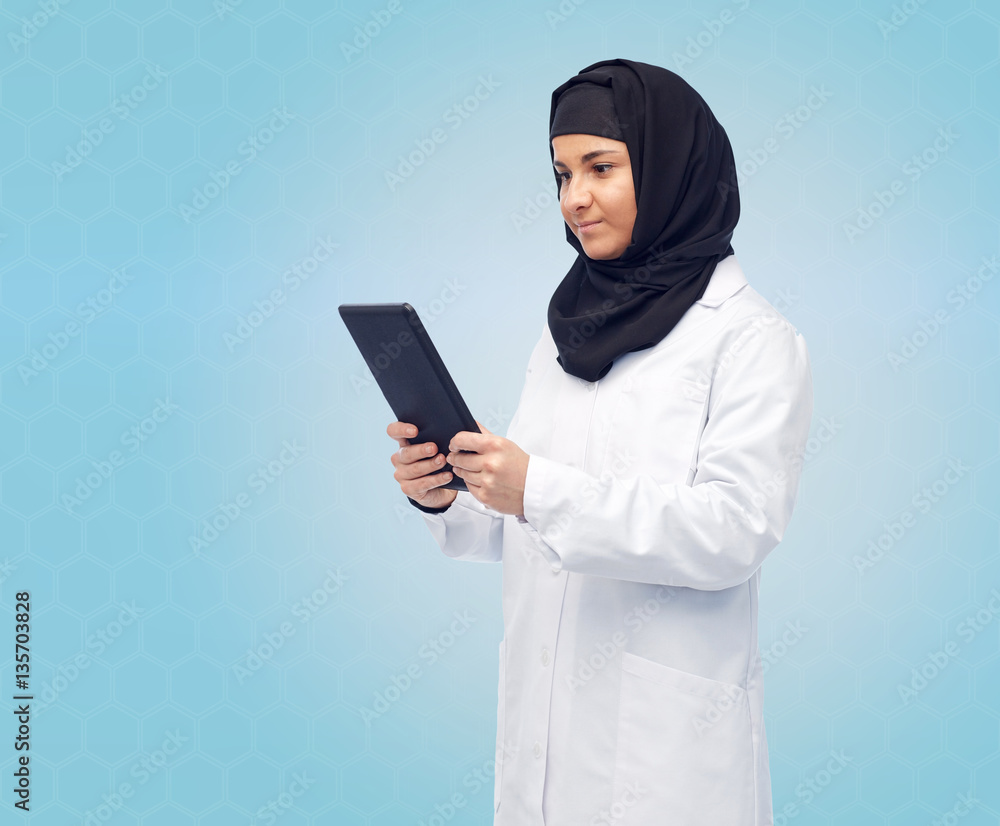 muslim female doctor in hijab with tablet pc muslim female doctor in hijab with tablet pc