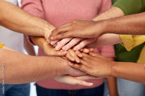 group of international people with hands together