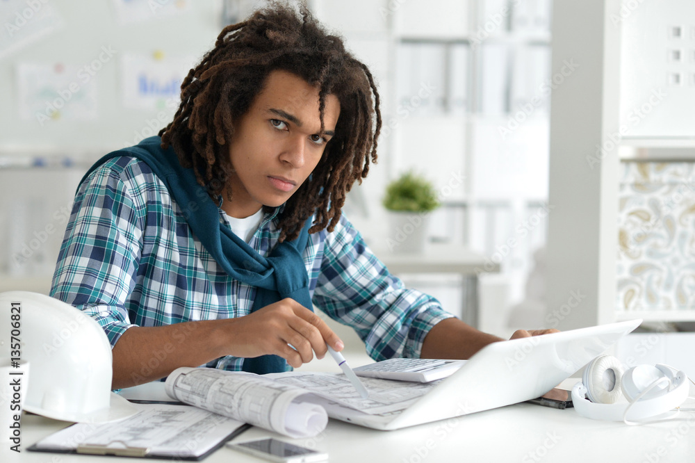 young afro man working at office young afro man working at office