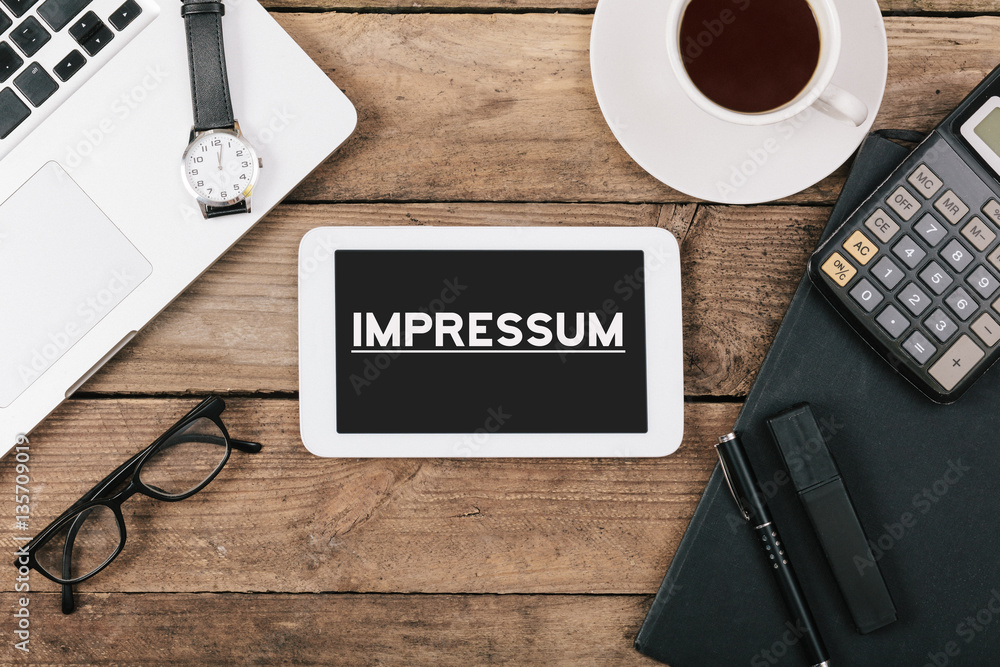 Impressum, German legal imprint text on tablet computer Impressum, German legal imprint text on tablet computer