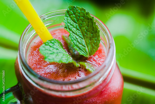 Wallpaper Mural Watermelon juice and mint leaf in a cup of glass with a straw, macro photo Torontodigital.ca