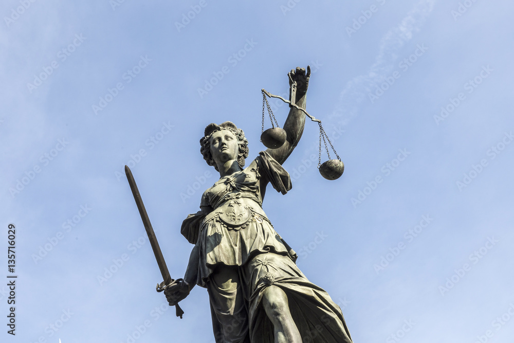 lady justice  under blue sky