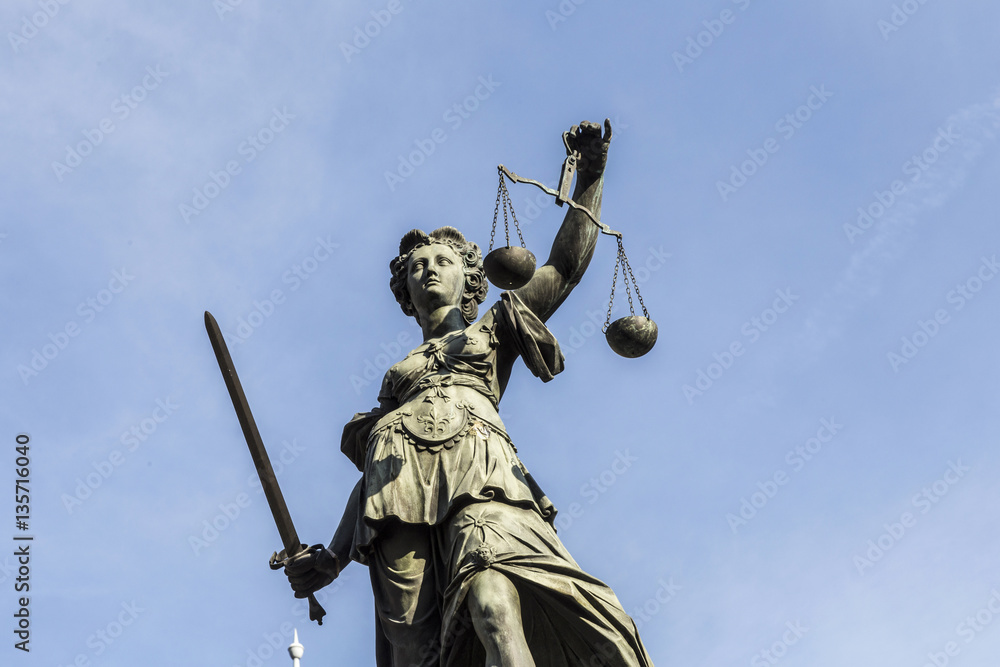 lady justice  under blue sky