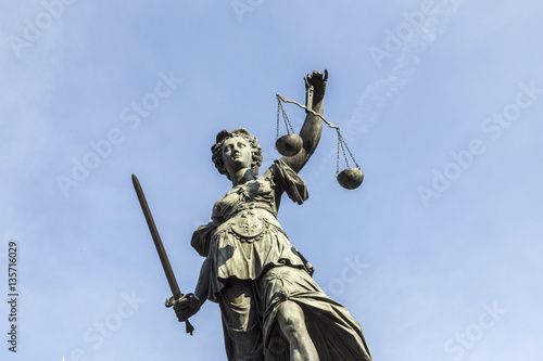 lady justice under blue sky