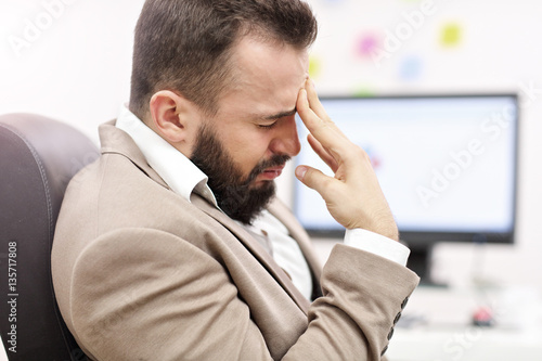 Businessman suffering from headache