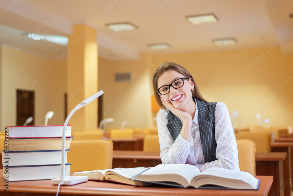 Woman reading book in library Woman reading book in library