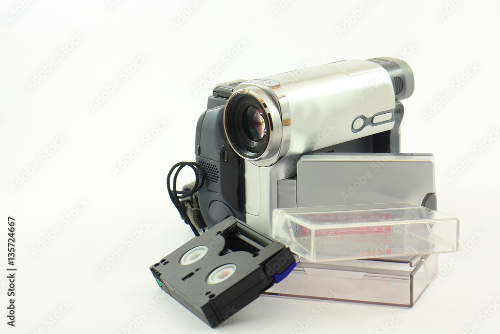 Digital video camera with tape on a white background Digital video camera with tape on a white background