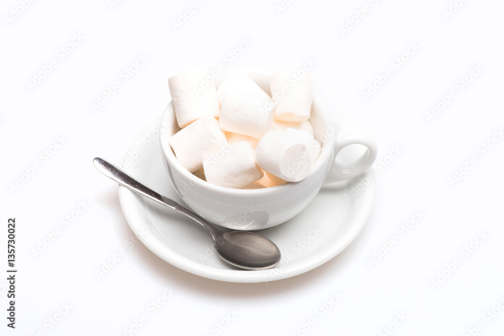 cup with marshmallow on plate with spoon cup with marshmallow on plate with spoon