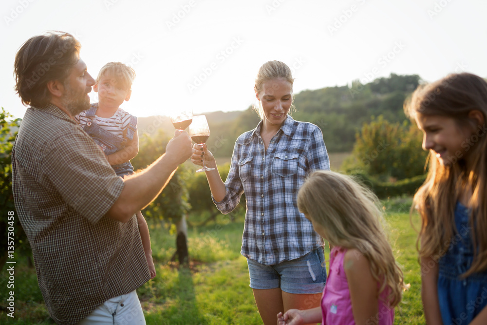 Fototapeta premium Winemaker family together in vineyard