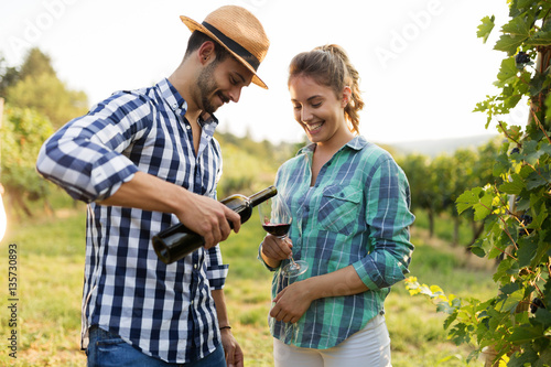 People tasting wine in vineyard © NDABCREATIVITY