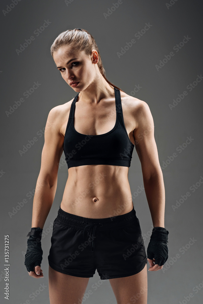 Strong girl posing with elastic sport bandage Strong girl posing with elastic sport bandage