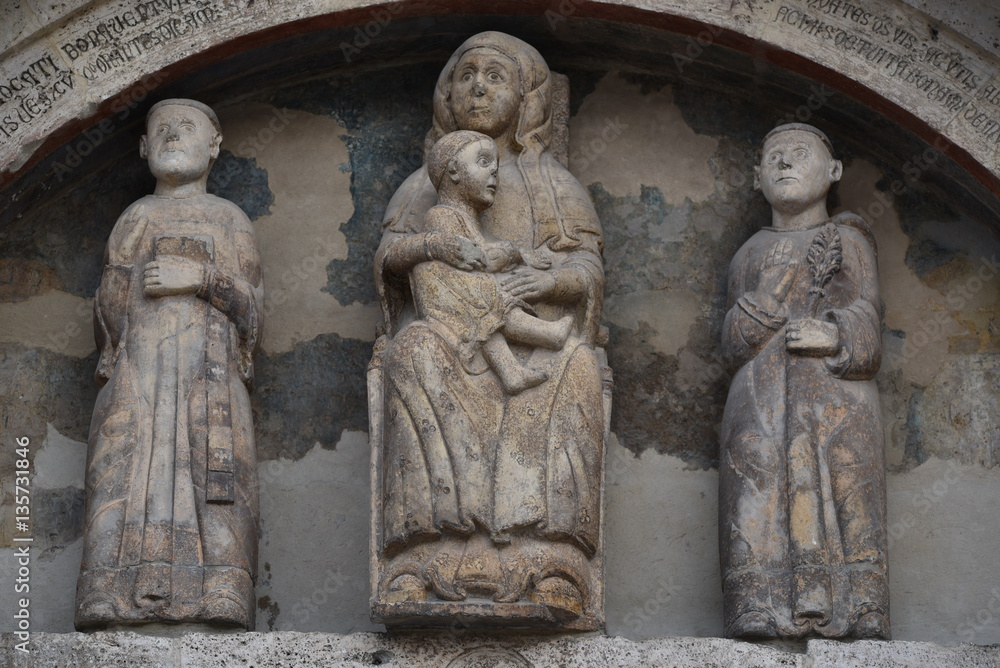 Church of  Saints Vincenzo e Anastasio, portal sculptures sith the two saints and Madonna with Child