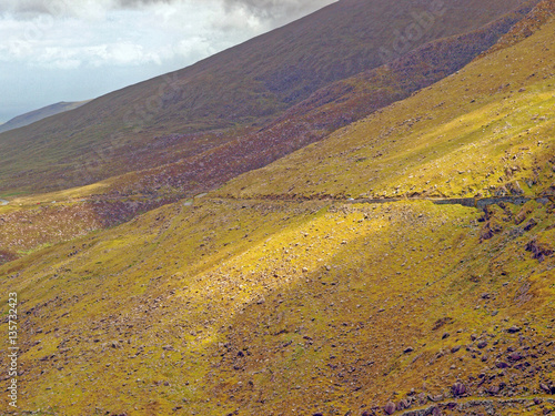 View of Conor Pass in the Dingle Peninsula, County Kerry, the highest mountain road in Ireland photo