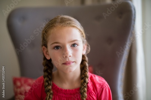 Valokuva Portrait of cute girl sitting on chair
