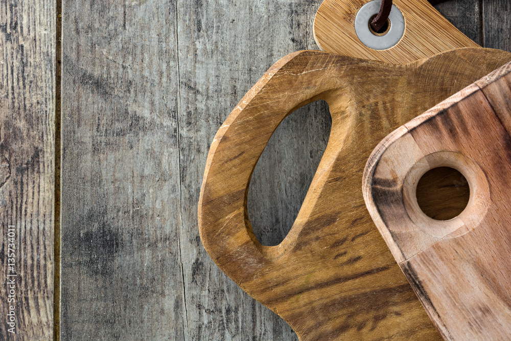 Cutting boards on wooden background
Cutting boards on wooden background