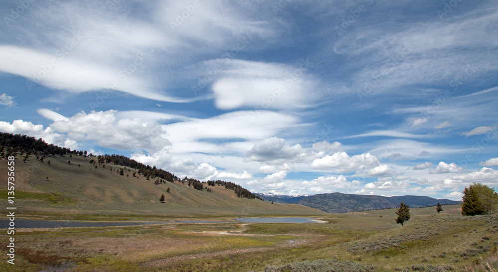 Blacktail Lakes under cirrus lenticular cloudscape in Yellowstone National Park in Wyoming