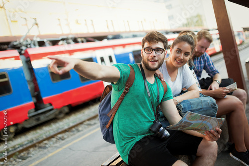 Young tourists travelling by train © NDABCREATIVITY
