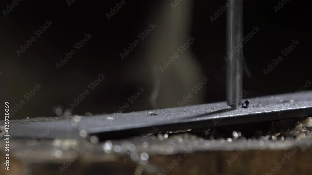 Hand of the worker drill metal and flying metal chips. Metalworking Hand of the worker drill metal and flying metal chips. Metalworking