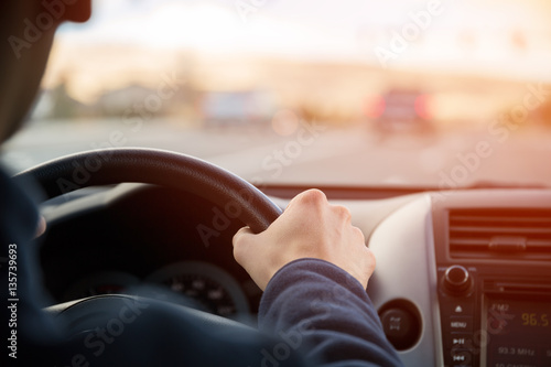 Fényképezés Driving car hands on steering wheel