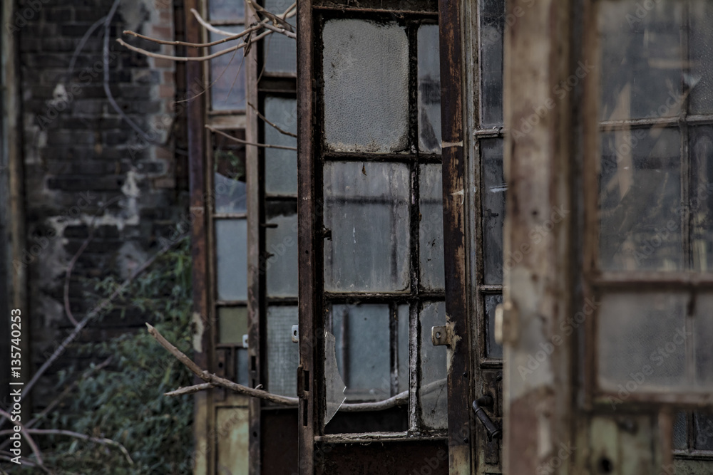 Rusty doors of an old, abandoned industrial facility