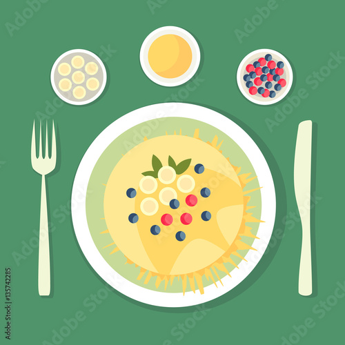 The flat composition. Pancake with honey dish decorated with berries, bananas and leaves. Dish with cutlery.
