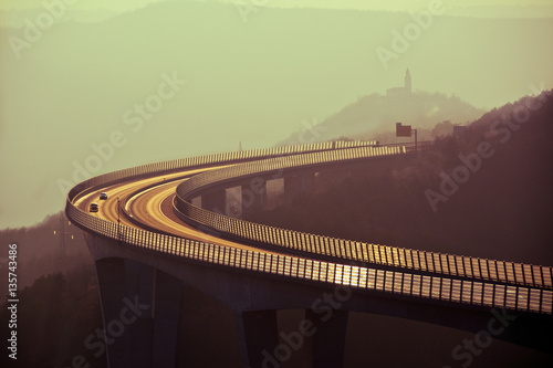 Open highway at sunset , vintage saturation