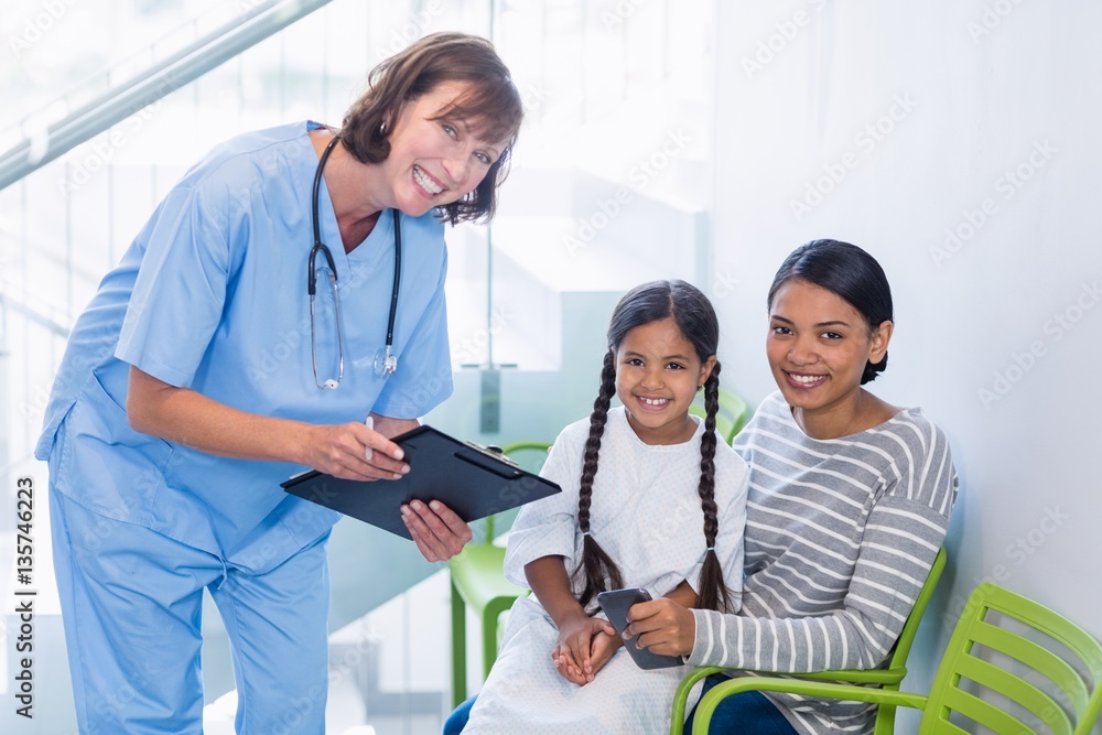 Portrait of nurse discussing a medical report Portrait of nurse discussing a medical report