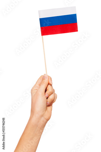Paper flag of Russian Federation in woman's hand