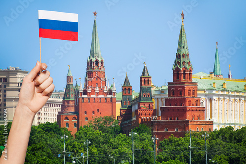 Russian flag and cityscape of Moscow on background