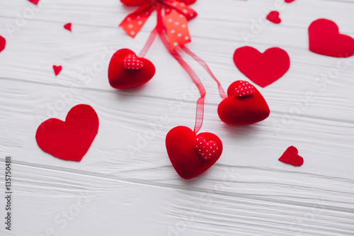 valentines day. red hearts and presents  on white wooden background 