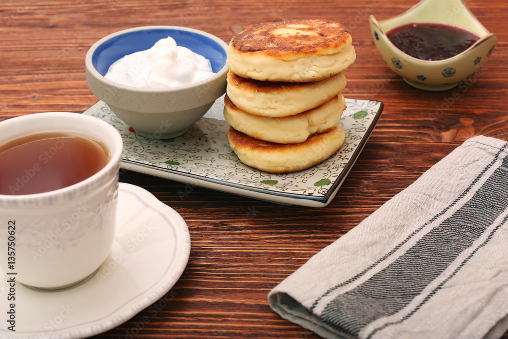 Cheese pancakes fried in a pan. Cheese pancakes fried in a pan.