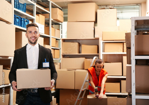 Young businessman holding b...