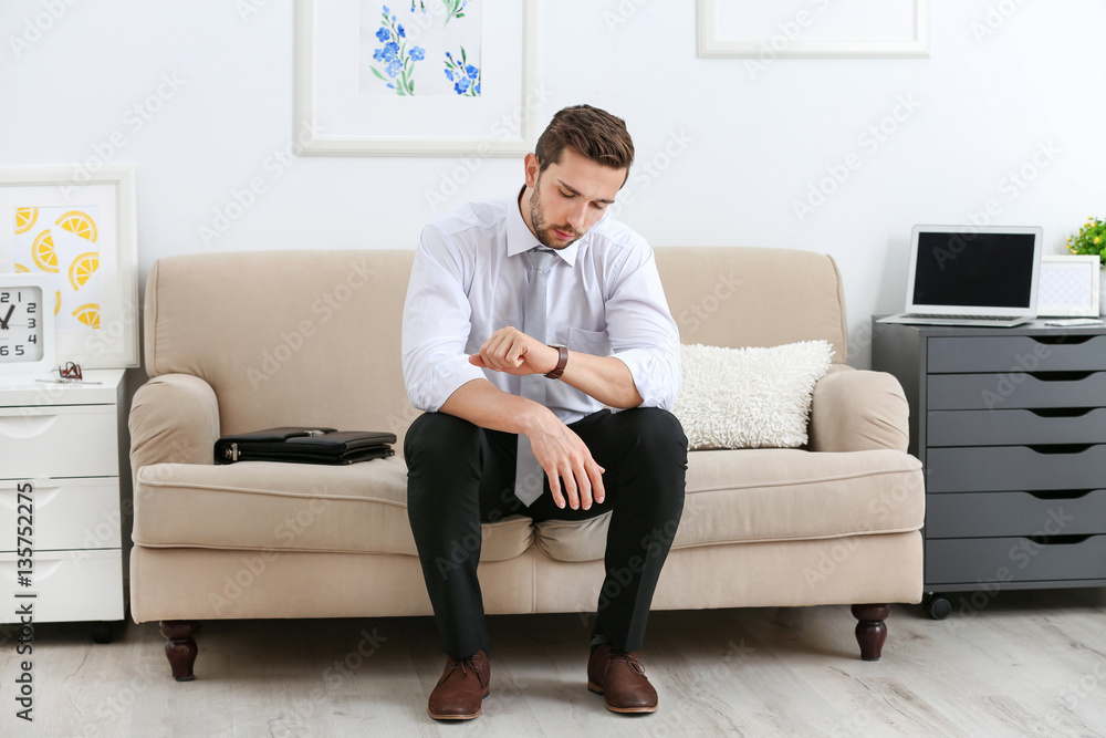 Young man waiting for interview indoors Young man waiting for interview indoors