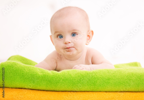 Cute funny baby lying on to...