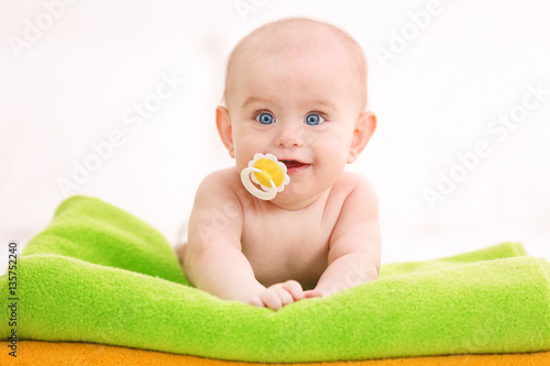 Cute funny baby lying on to...