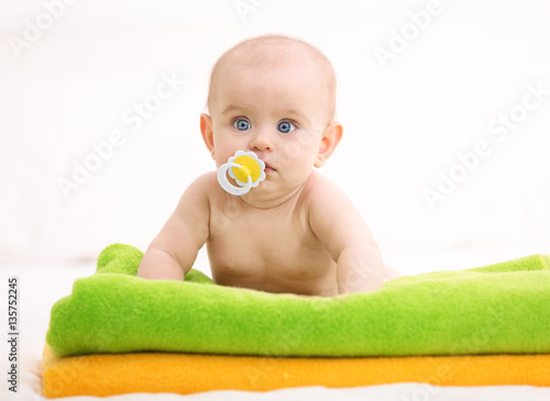 Cute funny baby lying on to...