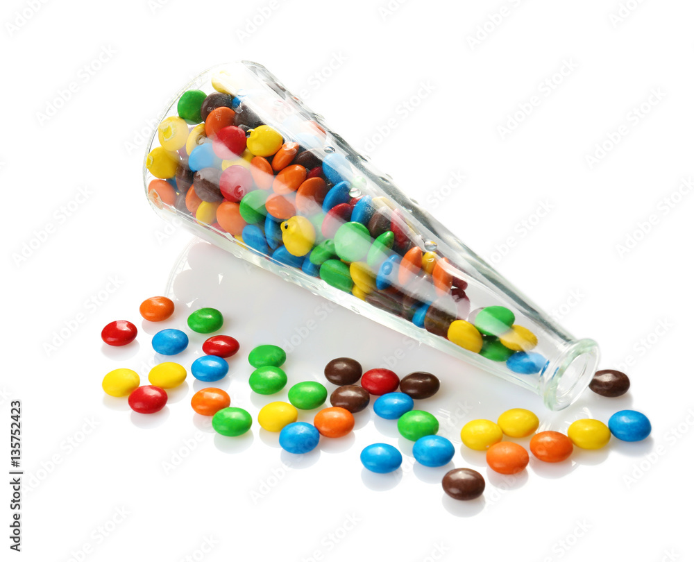 Colorful candies in glass vase on white background Colorful candies in glass vase on white background