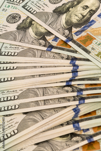 Stack of money in US dollars cash banknotes
