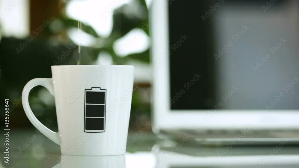 Mug cup with battery level symbol which changes color. Mug cup with battery level symbol which changes color.