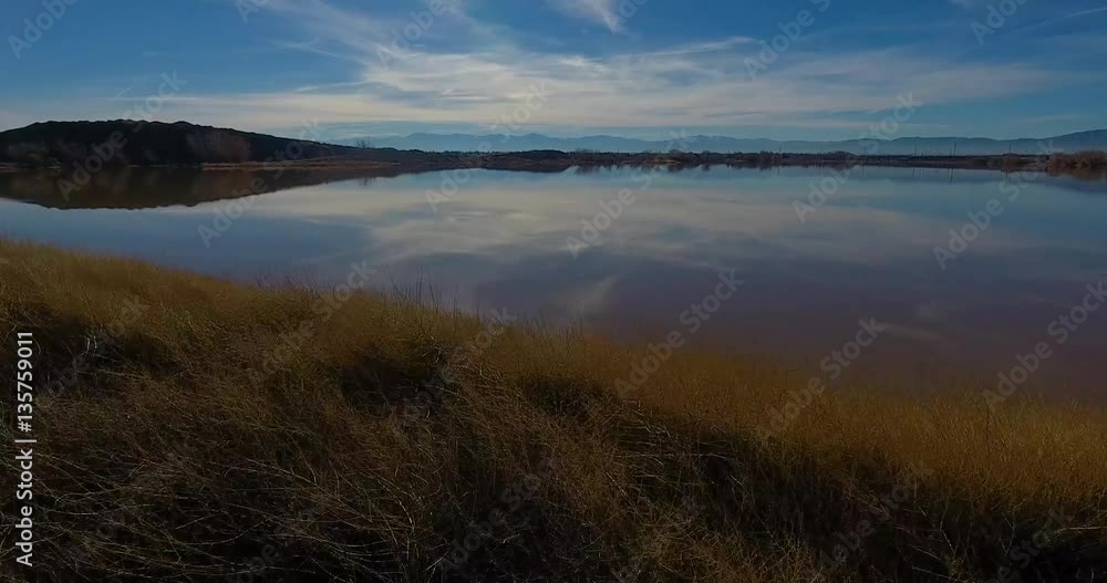 Aerial View Of A Pond Reflecting The Sun 4k 24fps Aerial View Of A Pond Reflecting The Sun 4k 24fps