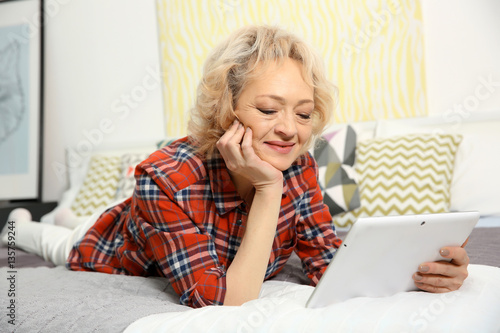 Senior woman making video c...