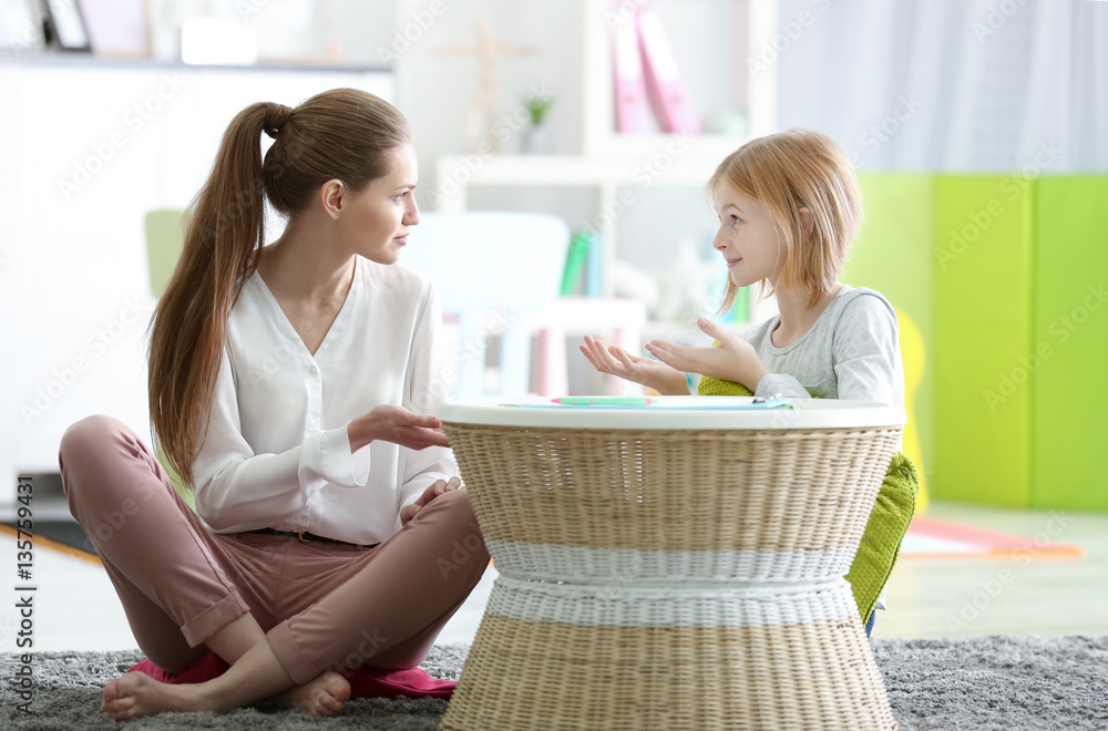 Young female psychologist working with teenager girl in office Young female psychologist working with teenager girl in office