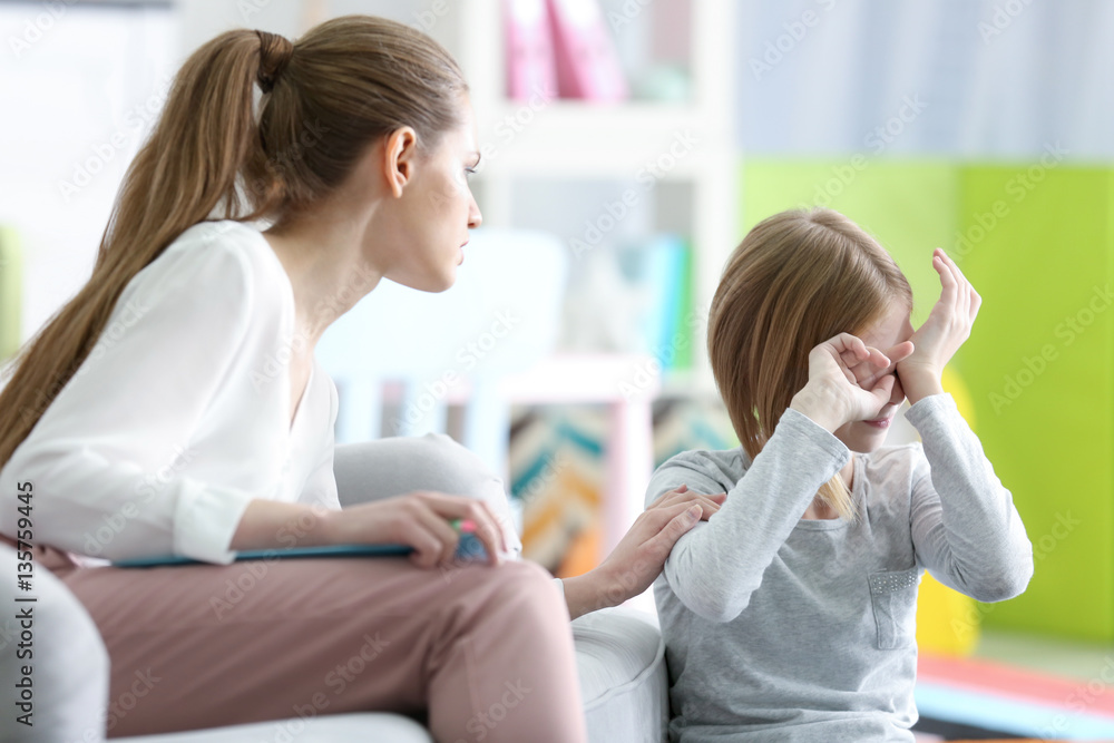 Young female psychologist working with teenager girl in office Young female psychologist working with teenager girl in office