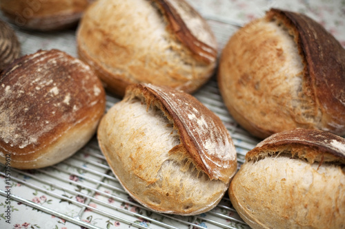 Freshly baked soda bread loaves cool on a wire rack photo