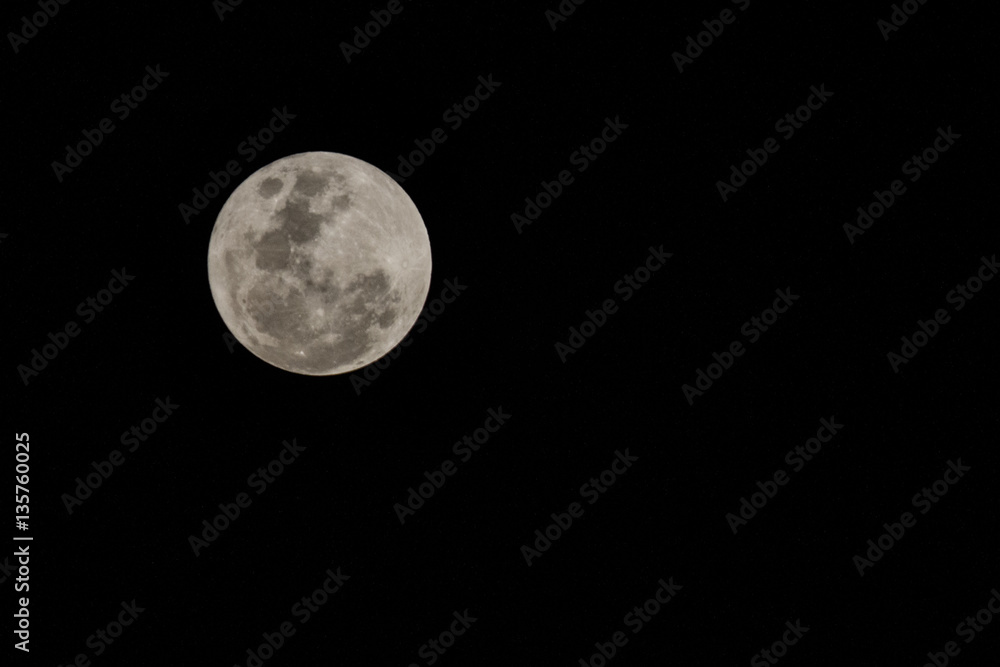 Fototapeta premium Blur moon with isolated black sky background for text adding